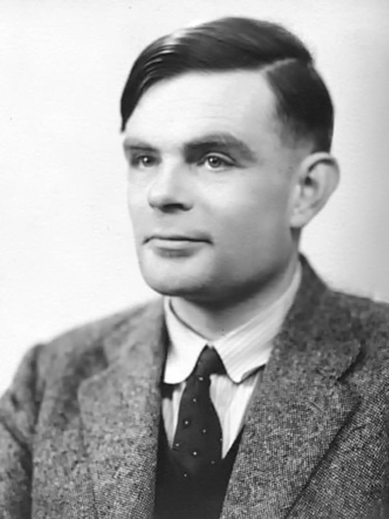 Black-and-white 1951 portrait photograph of mathematician Alan Turing, who proposed the Turing Test.