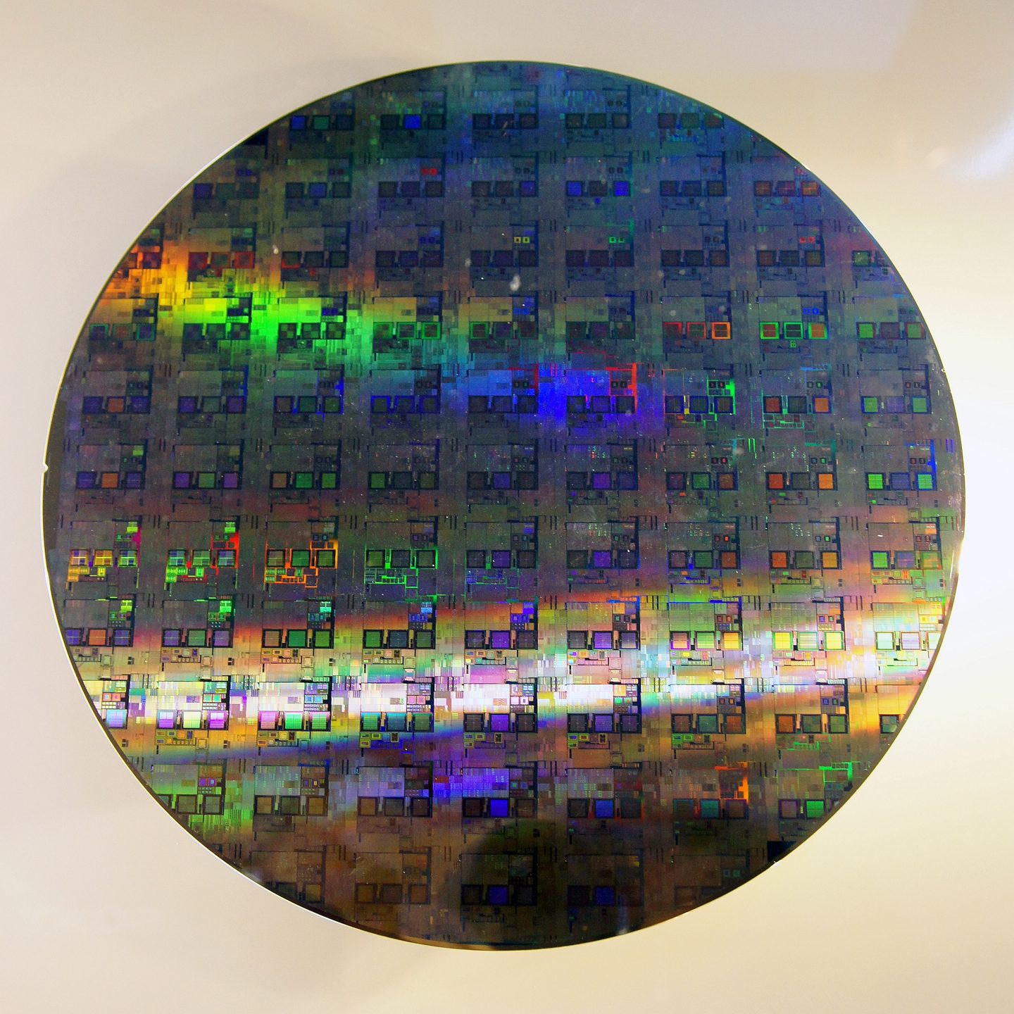A polished 12-inch silicon wafer of the kind patterned by lithography machines to make computer chips.