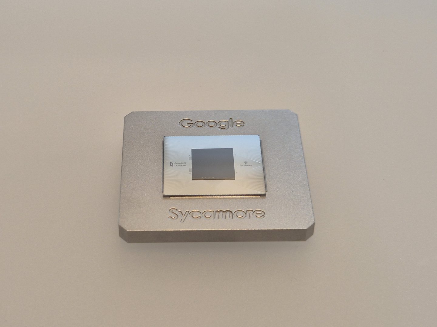 Close-up of Google's Sycamore quantum computing chip mounted in its cryogenic housing.